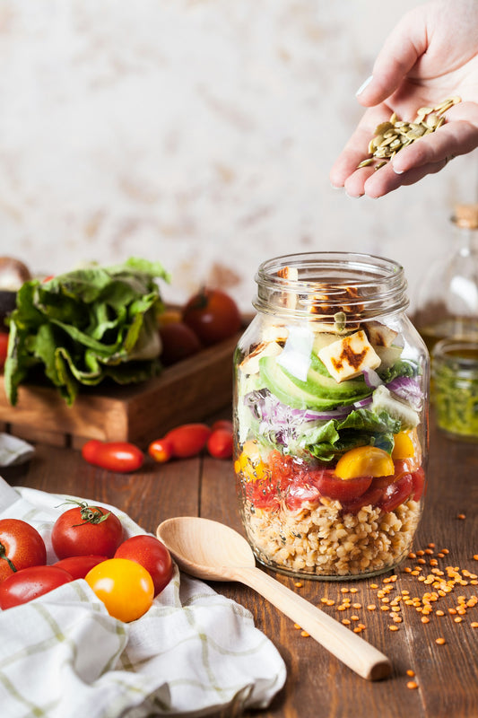 Hands holding fresh produce for everyday gut wellness — Women's Health